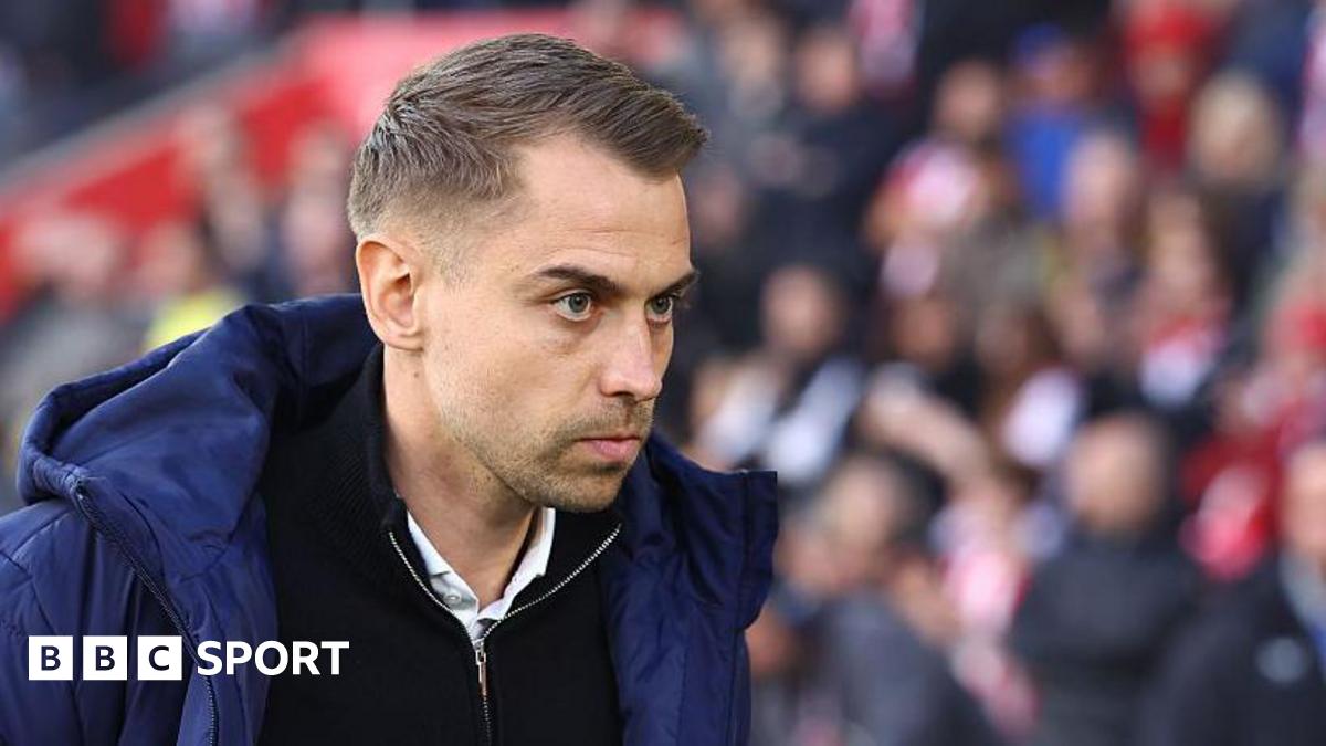 Southampton manager Tonda Eckert in blue coat and black zip-up top