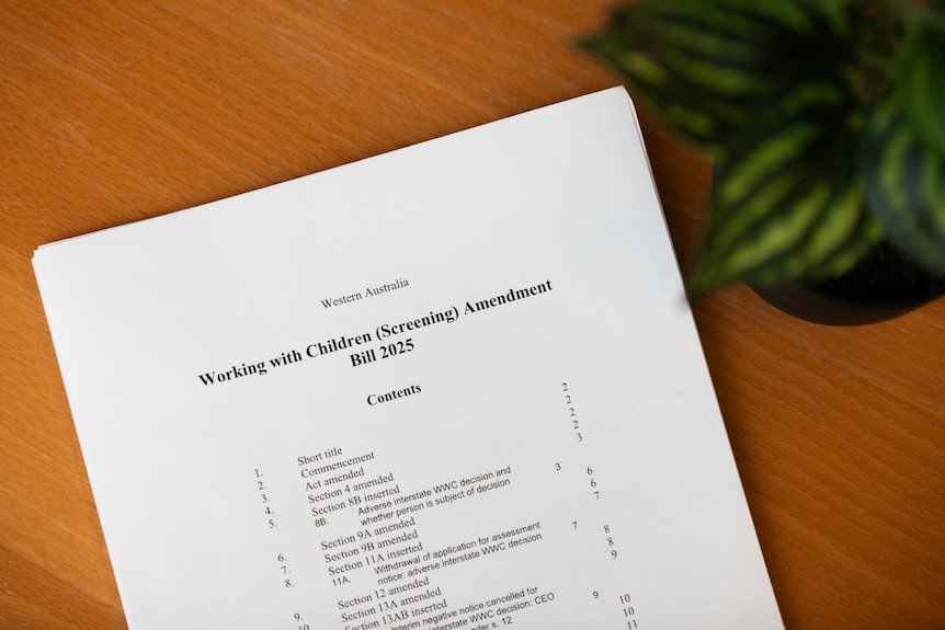 The front cover of the Working with Children (Screening) Amendment Bill 2025 on a table.