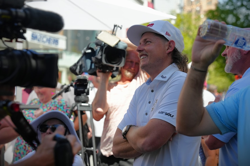 A man wearing a white baseball cap