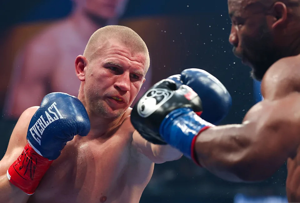 LAS VEGAS, NEVADA - SEPTEMBER 13: (L-R) Serhii Bohachuk punches Brandon Adams in their middleweight bout during Netflix's Canelo v Crawford Fight Night at Allegiant Stadium on September 13, 2025 in Las Vegas, Nevada. (Photo by Sarah Stier/Getty Images for Netflix)