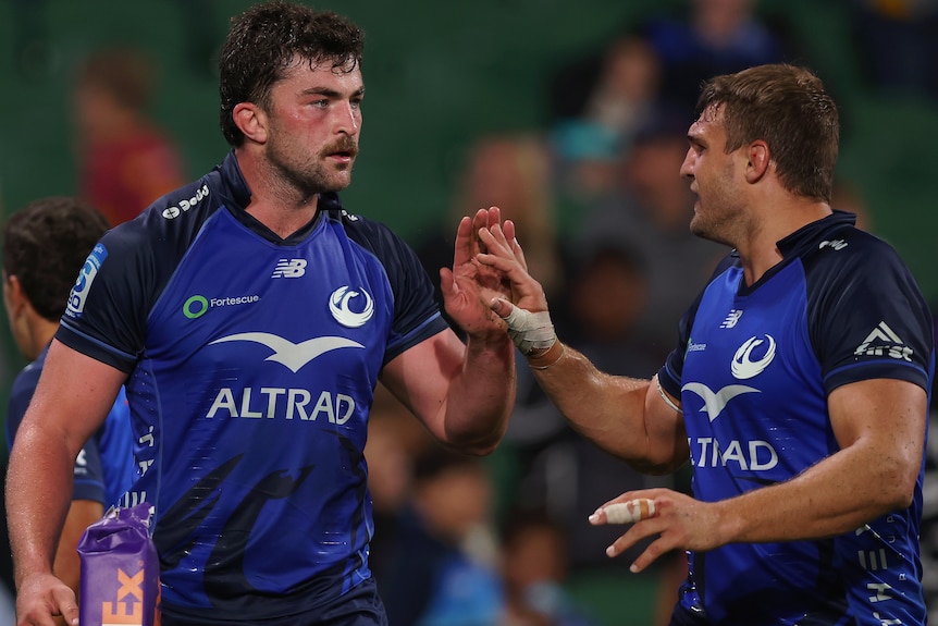 Jeremy Williams and Nick Champion de Crespigny shake hands during a Western Force match.