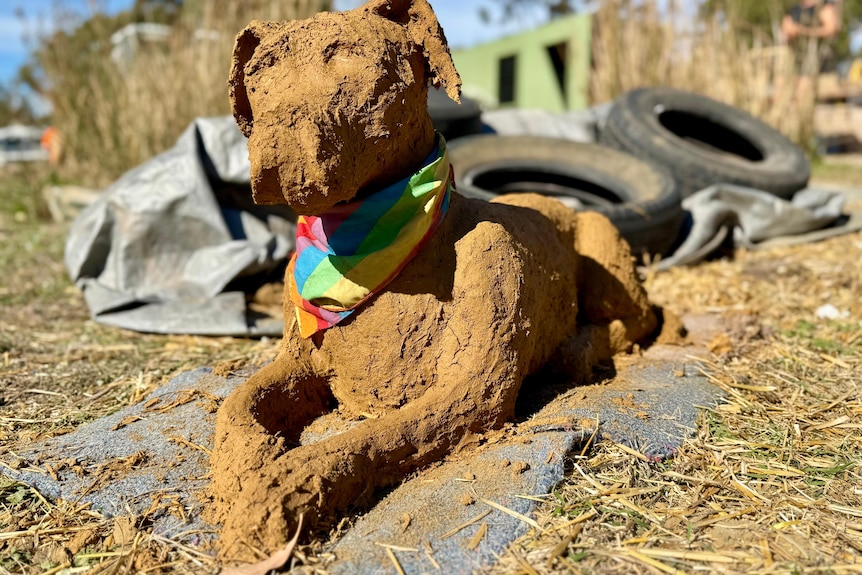 a dog made entirely of mud