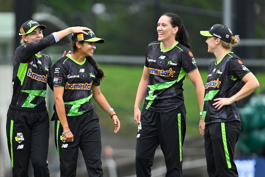 Sydney Thunder teammates celebrate young player Hasrat Gill.