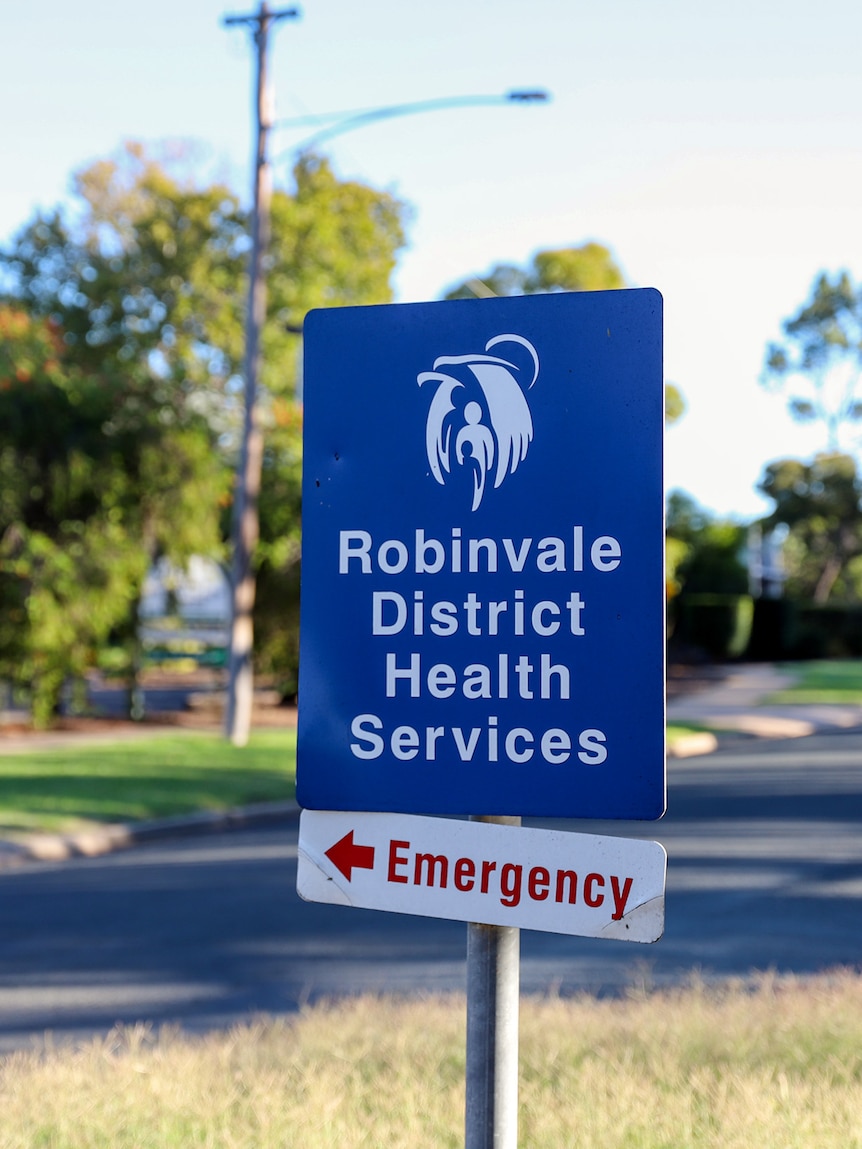 A blue sign with white writing reads: 'Robinvale District Health Services' a white sign with red writing says 'Emergency' 