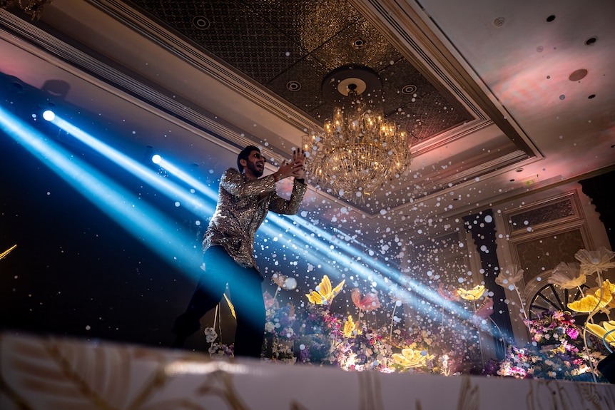 A man dancing on stage.