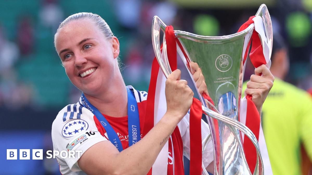 Arsenal forward Beth Mead holding the Women's Champions League trophy