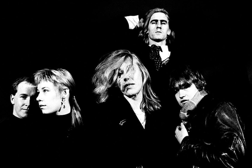 Black and white photo of the five members of The Go-Betweens