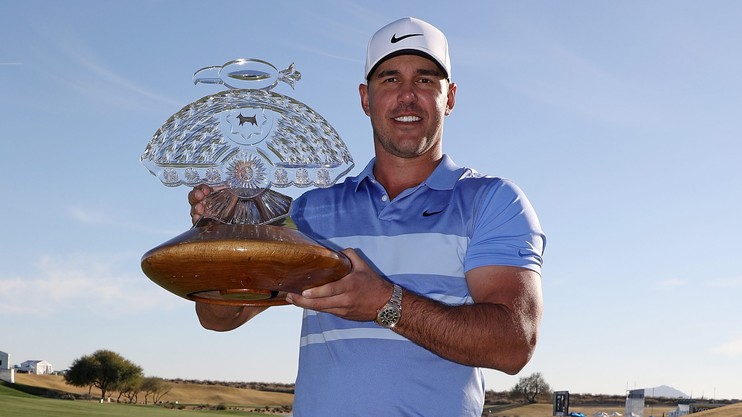 Brooks Koepka with the WM Phoenix Open trophy