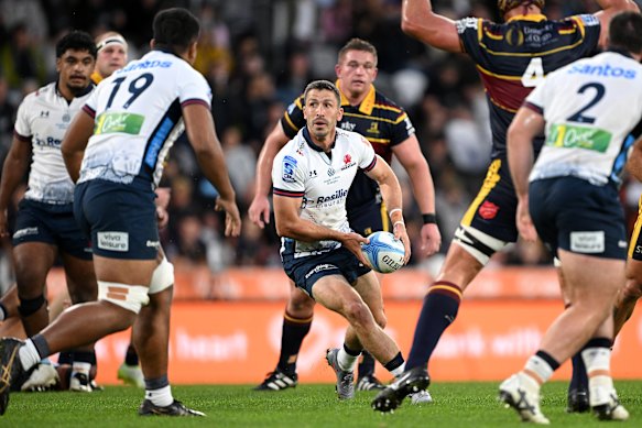 Waratahs halfback Jake Gordon looks for space in Dunedin