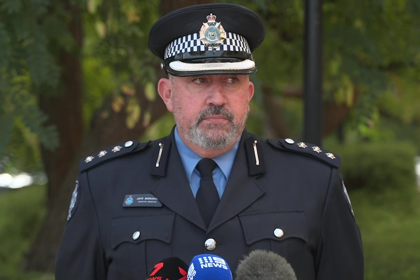 Detective Inspector Jayd Morawski speaks at a press conference in full police uniform.
