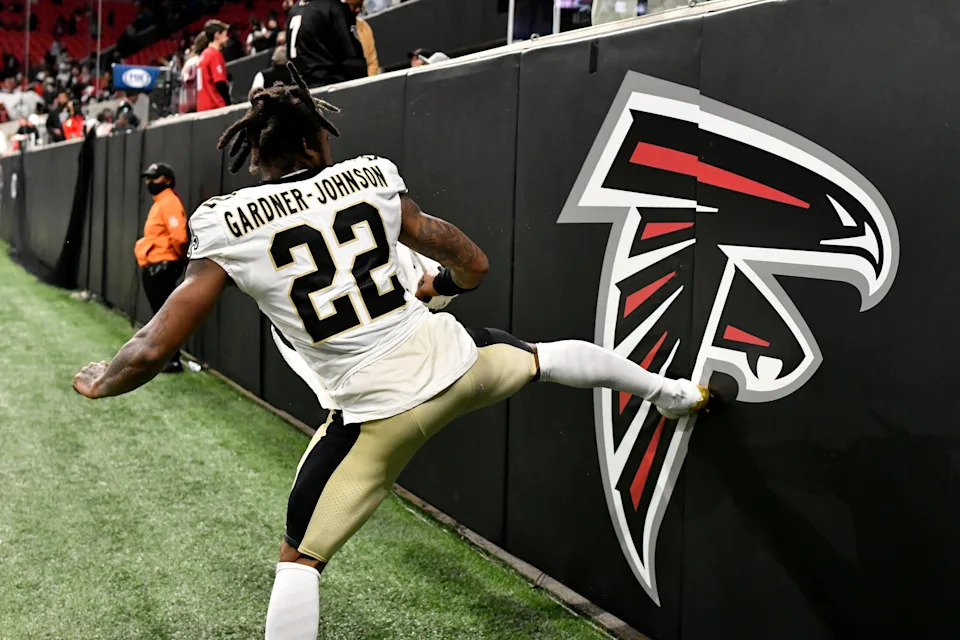 Chauncey Gardner-Johnson #22 of the New Orleans Saints kicks the Atlanta Falcons logo after the game at Mercedes-Benz Stadium on January 09, 2022 in Atlanta, Georgia.