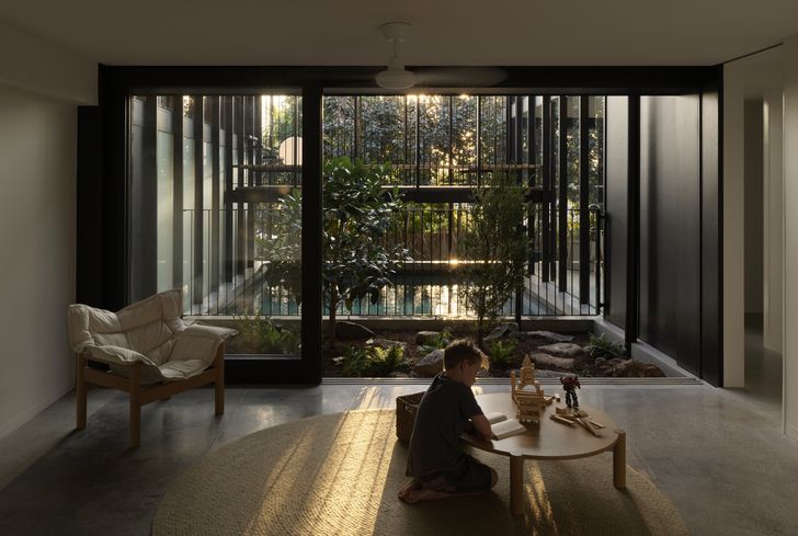 Rooms on both floors of Half Light House look into and across an atrium and pool.