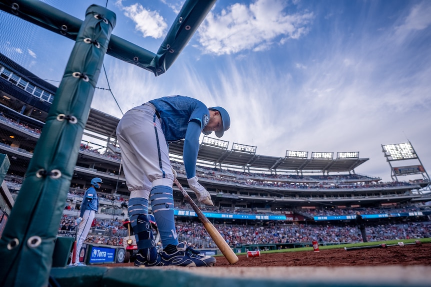 Curtis Mead wearing a blue kit on the field ready to bat during a baseball game.
