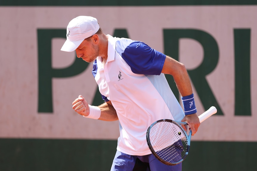 James Duckworth pumps his fist during a tennis match at the French Open.