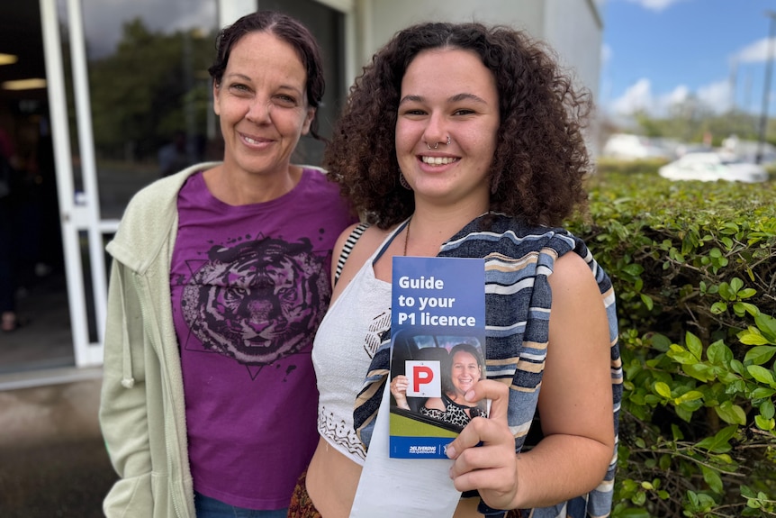 Smiling teen with woman