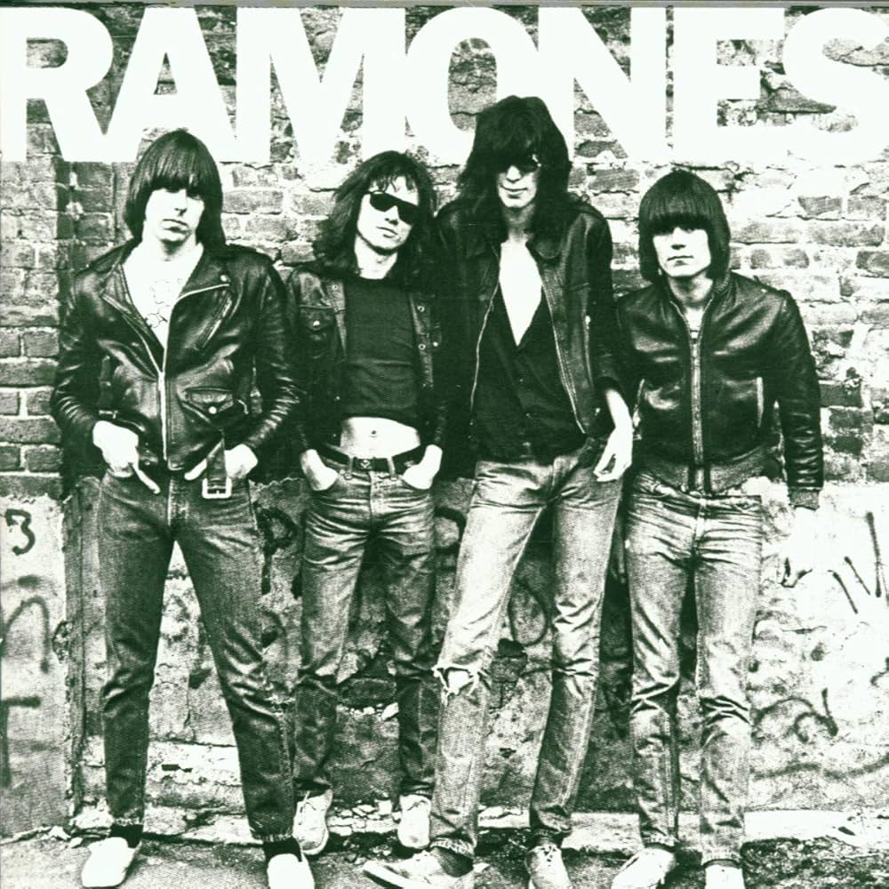 Album cover featuring the band members of Ramones standing against a brick wall