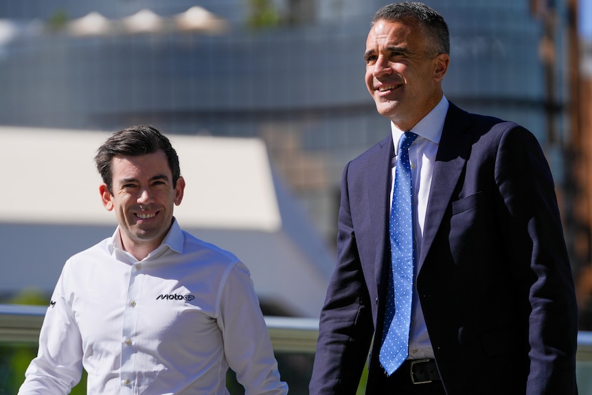 Carlos Ezpeleta and Peter Malinauskas walk side by side smiling.