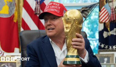 US President Donald Trump holding the World Cup trophy
