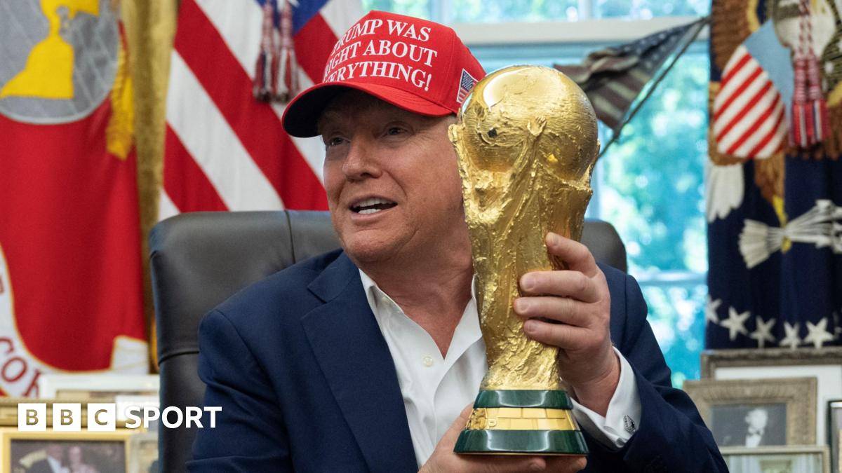 US President Donald Trump holding the World Cup trophy