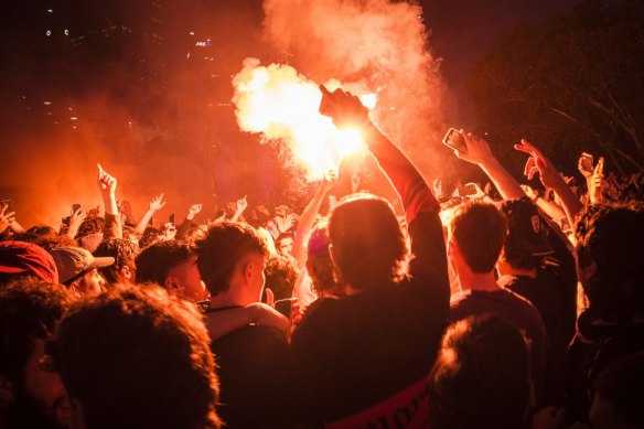 Flares are thrown at Federation Square during the World Cup in 2022.