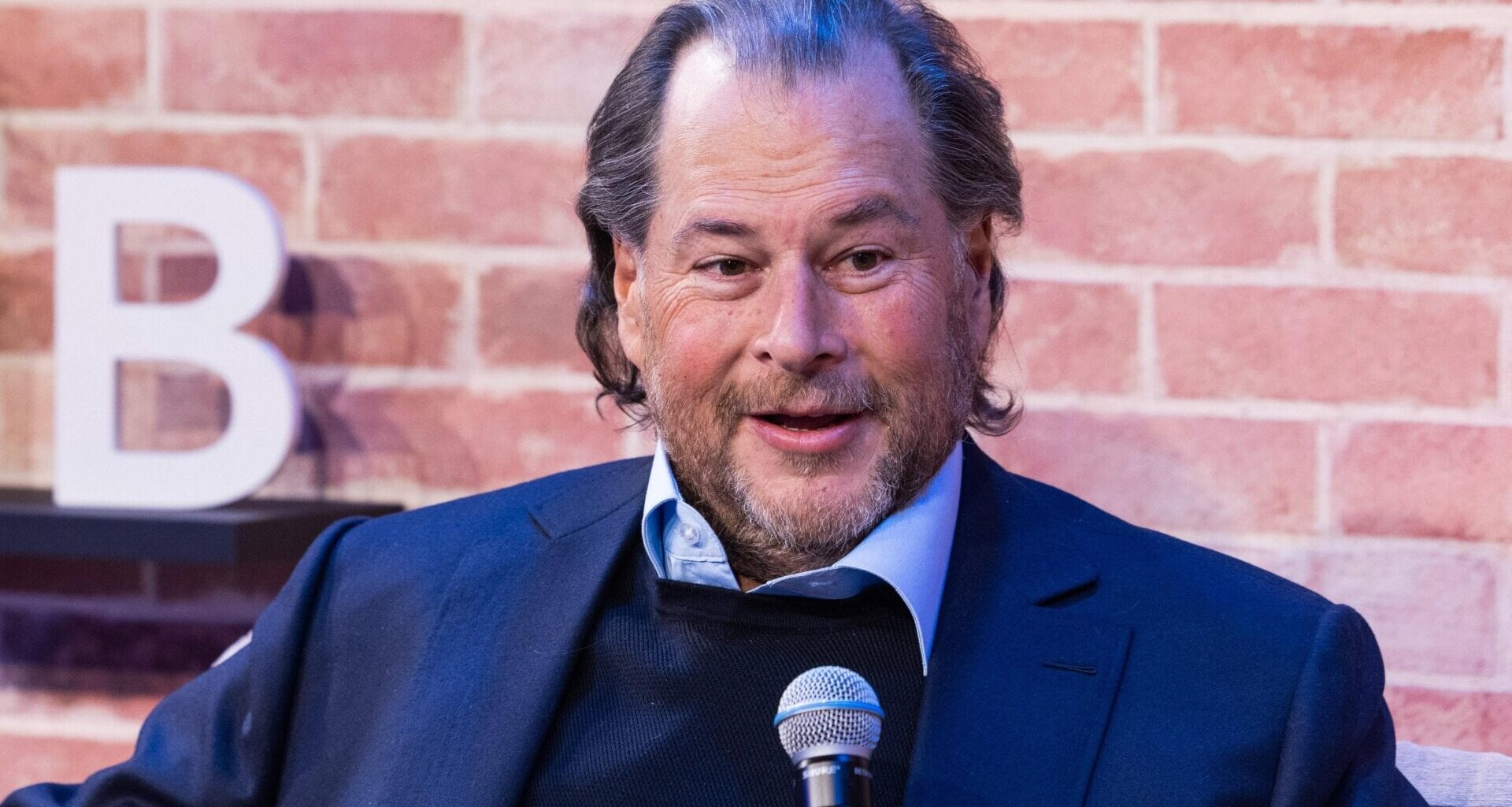 Marc Benioff speaking into a microphone