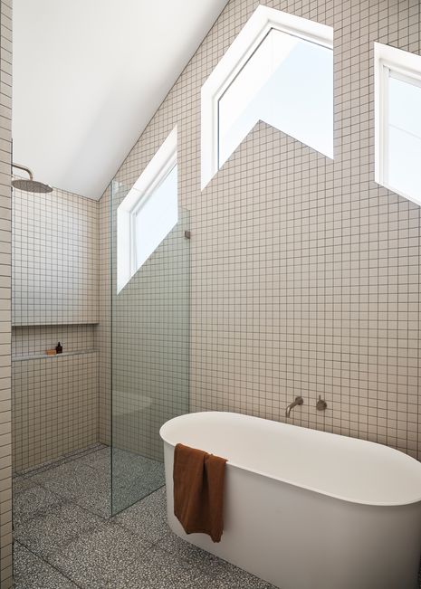 Geometric-shaped windows pair beautifully with mosaic tiles and terrazzo finishes.