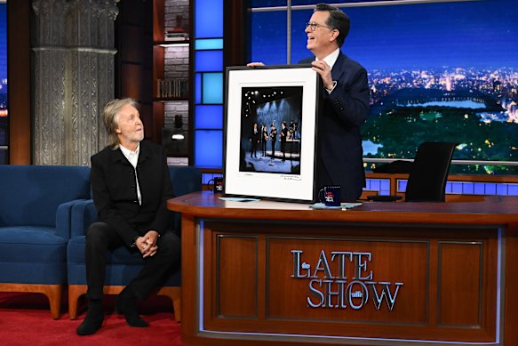 Paul McCartney’s parting gift to Stephen Colbert – a photo of the Beatles appearing on the same set for the Ed Sullivan Show 62 years ago.