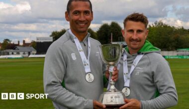 Leicestershire head coach Alfonso Thomas and assistant coach James Taylor hold the County Championship Division Two trophy