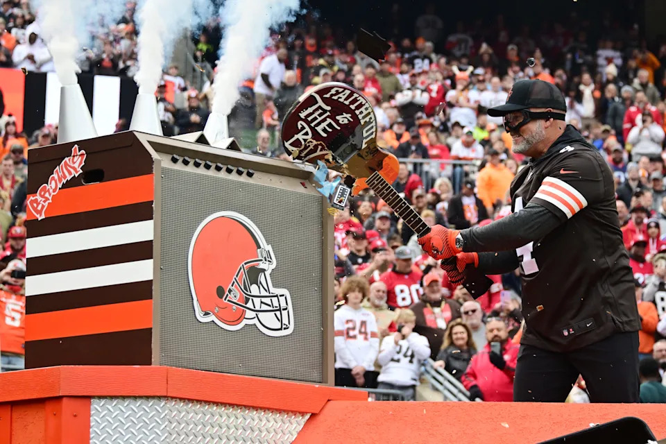 Oct 15, 2023; Cleveland, Ohio, USA; Former Cleveland Browns kicker Phil Dawson smashes a guitar with San Francisco 49ers logos before the game between the Browns and the 49ers at Cleveland Browns Stadium. Mandatory Credit: Ken Blaze-USA TODAY Sports