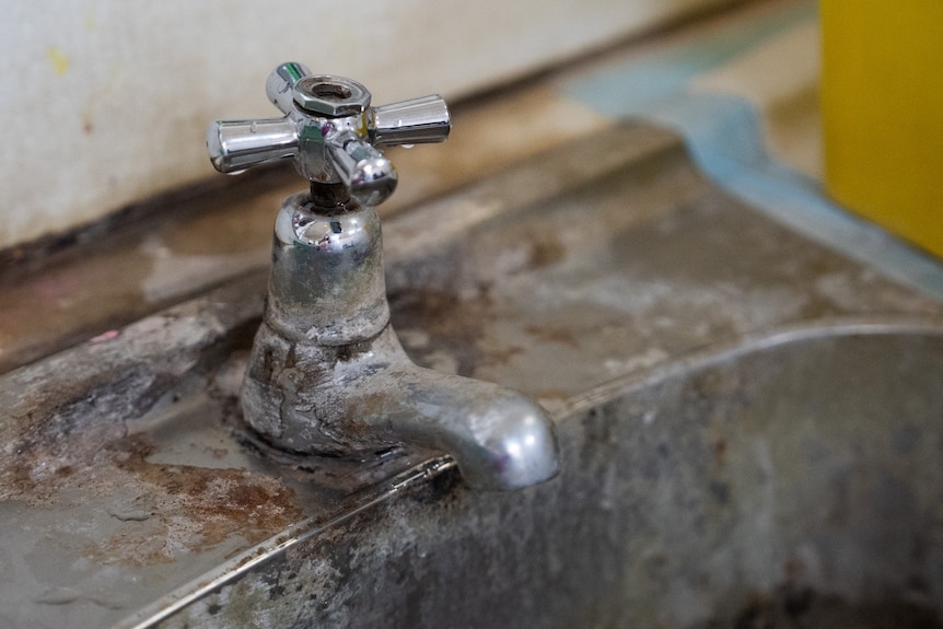 A photo of a run down rust old tap at Buka hospital.