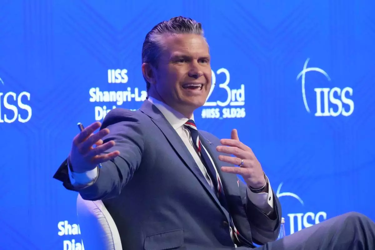 U.S. Defense Secretary Pete Hegseth gestures as he speaks during the Shangri-La Dialogue, Asia's annual defense and security forum, in Singapore, Saturday, May 30, 2026. (AP Photo/Achmad Ibrahim)