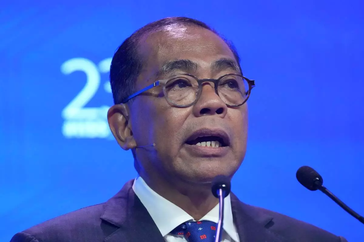 Malaysia's Defense Minister Dato' Seri Mohamed Khaled Nordin delivers a speech during the Shangri-La Dialogue, Asia's annual defense and security forum, in Singapore, Sunday, May 31, 2026. (AP Photo/Achmad Ibrahim)