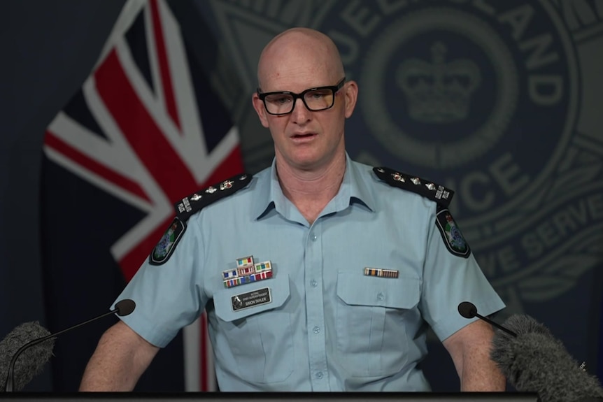 A police officer at a press conference.
