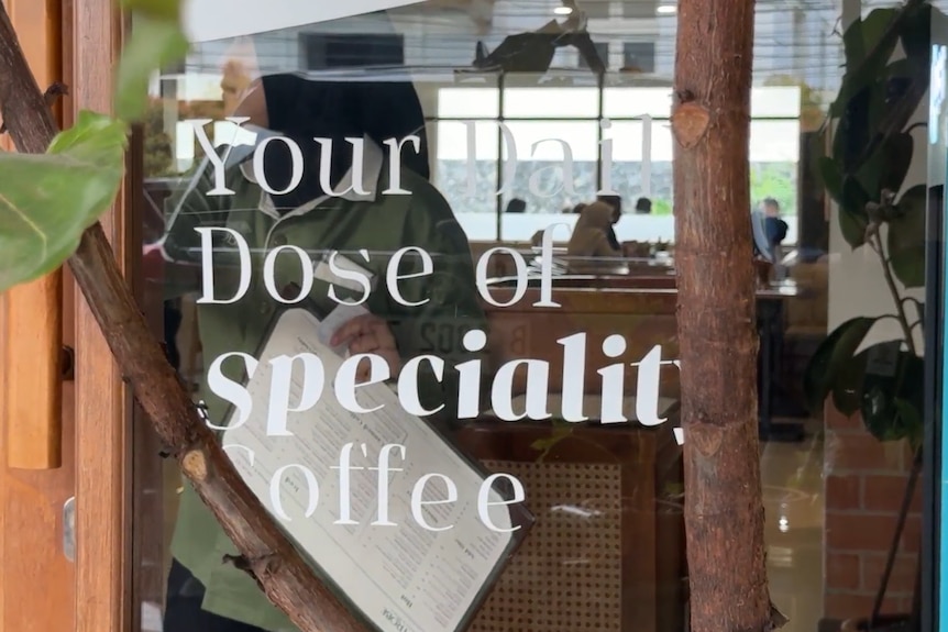 A glass door with text on it.