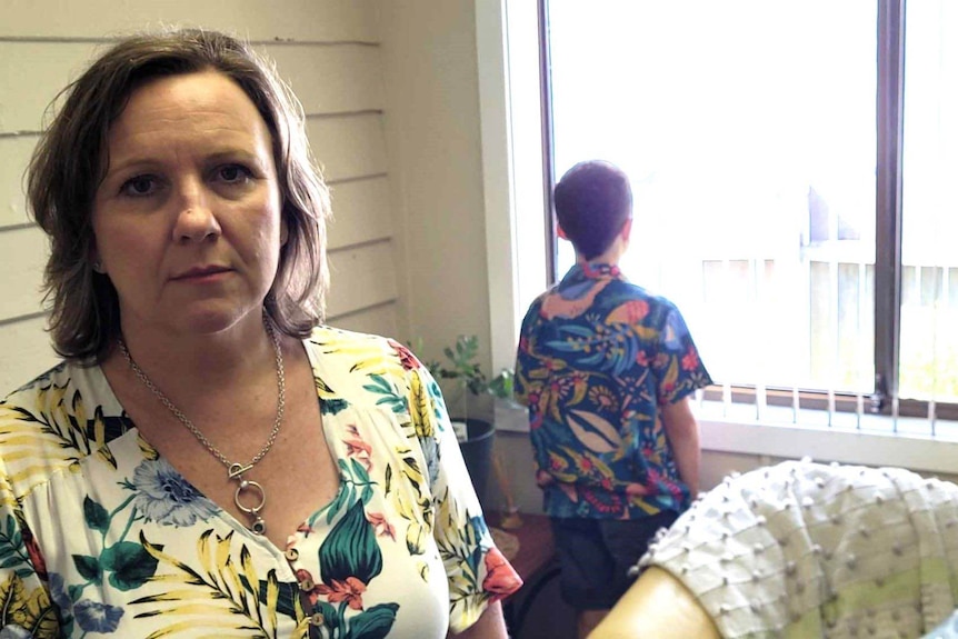 woman in foreground with woman facing away in background