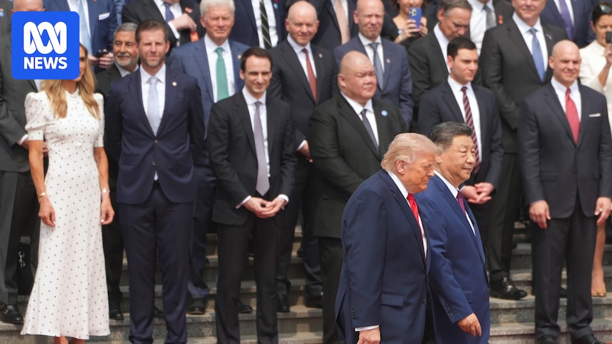 Who is in President Trump's entourage of billionaires and executives in Beijing?