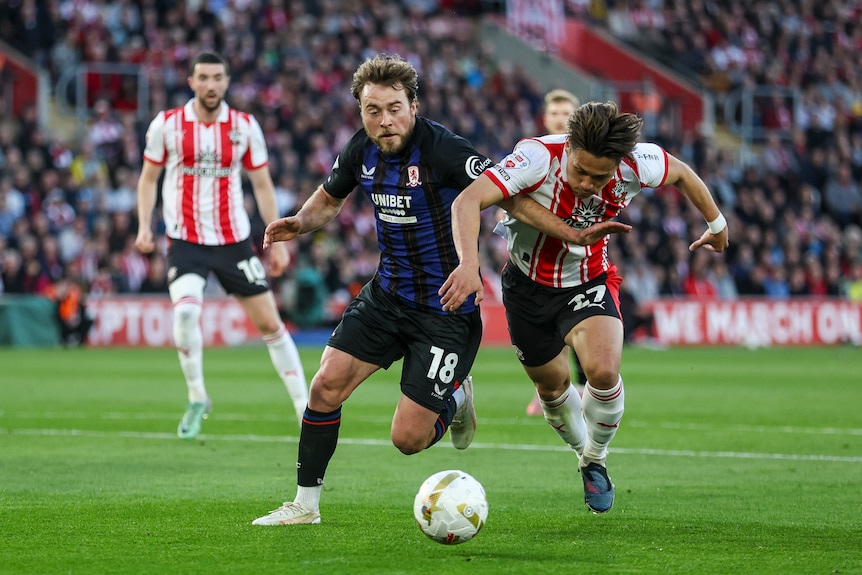 Middlesbrough and Southampton players battle for the football