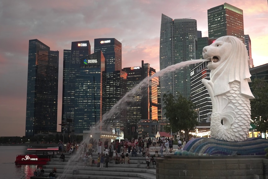The merlion statue, half mermaid, half lion, spewing water along the Singapore espalanade.