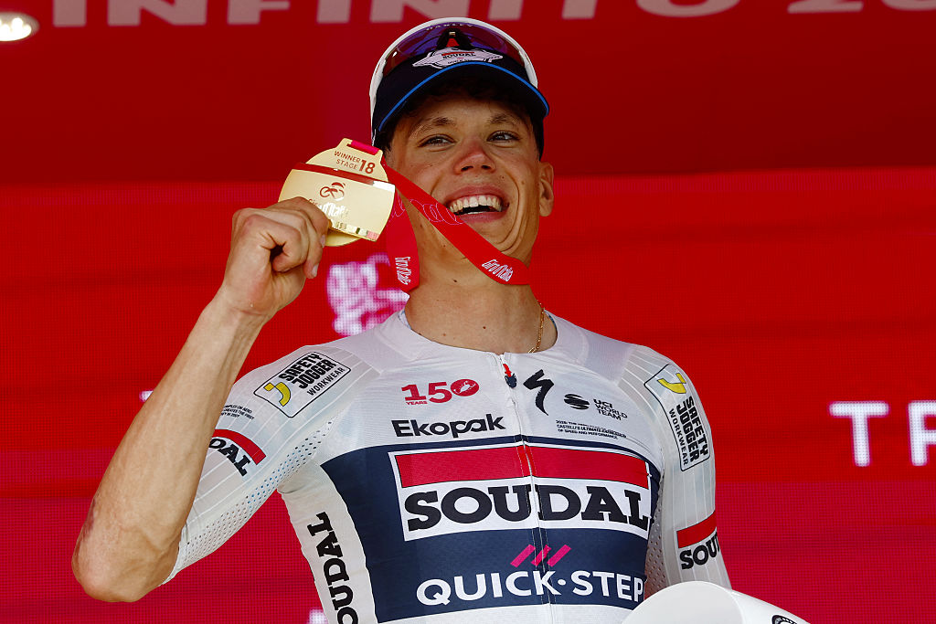 Soudal Quick-Step French rider Paul Magnier celebrates on the podium of the 18th stage of the Giro d'Italia 2026 - Tour of Italy cycling race between Fai della Paganella and Pieve di Soligo, Italy, on May 28, 2026. (Photo by Luca Bettini / AFP)