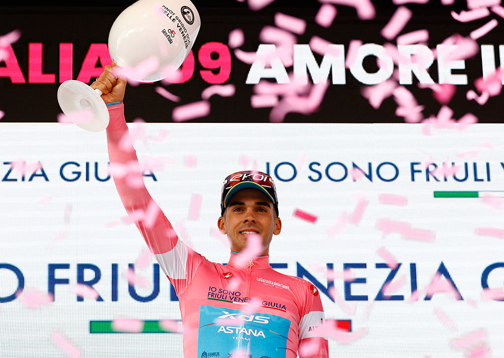 XDS Astana Team Uruguayan rider Guillermo Silva wearing the overall leader's pink jersey (Maglia Rosa) celebrates on the podium after the 3nd stage of the Giro d'Italia 2026 - Tour of Italy cycling race between Plovdiv and Sofia, Bulgaria, on May 10, 2026. (Photo by Luca Bettini / AFP)
