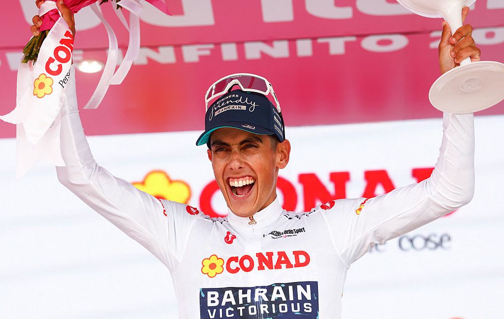 Bahrain - Victorious Portuguese rider Afonso Eulalio celebrates on the podium with the best young rider's white jersey after the 20th stage of the Giro d'Italia 2026 - Tour of Italy cycling race between Gemona del Friuli and Piancavallo, Italy, on May 30, 2026. (Photo by Luca Bettini / AFP)
