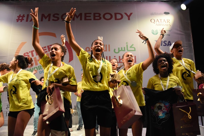 Street Child World Cup participants shouting, chanting and dancing