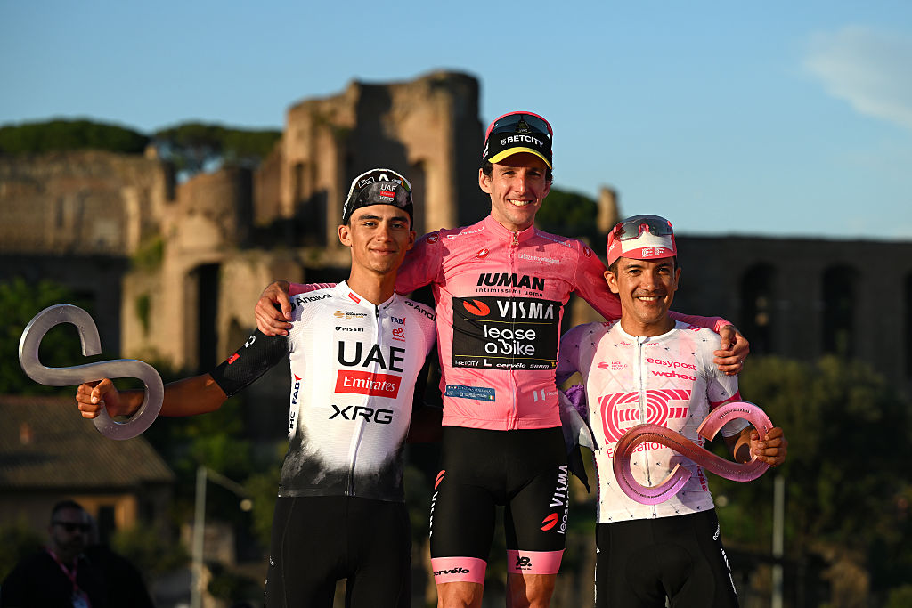 ROME, ITALY - JUNE 01: (L-R) Isaac Del Toro of Mexico and Team UAE Team Emirates - XRG on second place, race winner Simon Yates of Great Britain and Team Visma | Lease a Bike - Pink Leader Jersey and Richard Carapaz of Ecuador and Team EF Education - EasyPost on third place celebrate on the podium ceremony after the 108th Giro d&amp;apos;Italia 2025, Stage 21 a 144.8km stage from Rome to Rome / #UCIWT / on June 01, 2025 in Rome, Italy. (Photo by Dario Belingheri/Getty Images)
