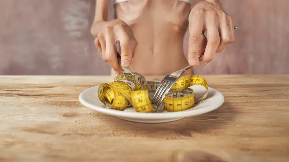 Skinny,young,woman,with,anorexia,,bulimia,at,eating.,too,little