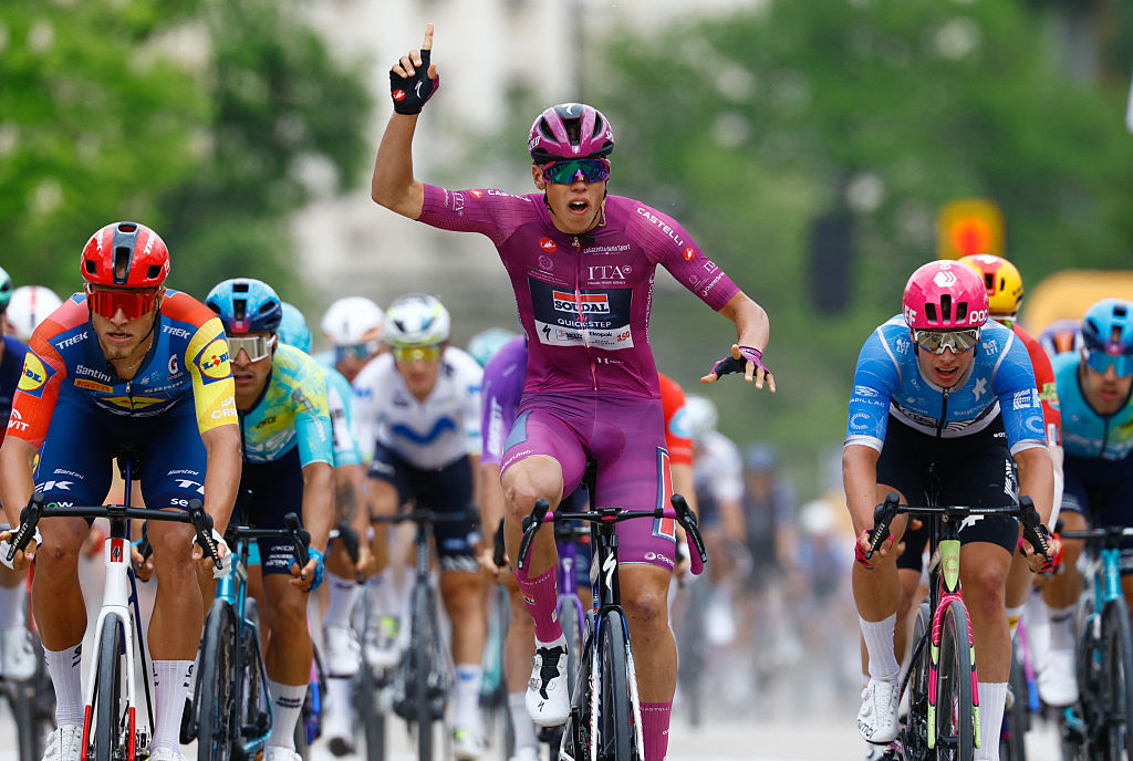 Soudal Quick-Step French rider Paul Magnier wearing the points classification mauve jersey (Maglia Ciclamino) celebrates as he crosses the finish line to win the 3nd stage of the Giro d'Italia 2026 - Tour of Italy cycling race between Plovdiv and Sofia, Bulgaria, on May 10, 2026. (Photo by Luca Bettini / AFP)