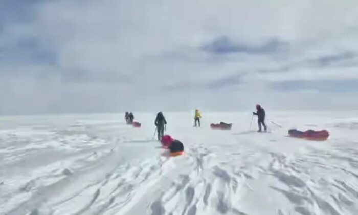 A team of Finnish adventurers skiing on the Greenland ice sheet