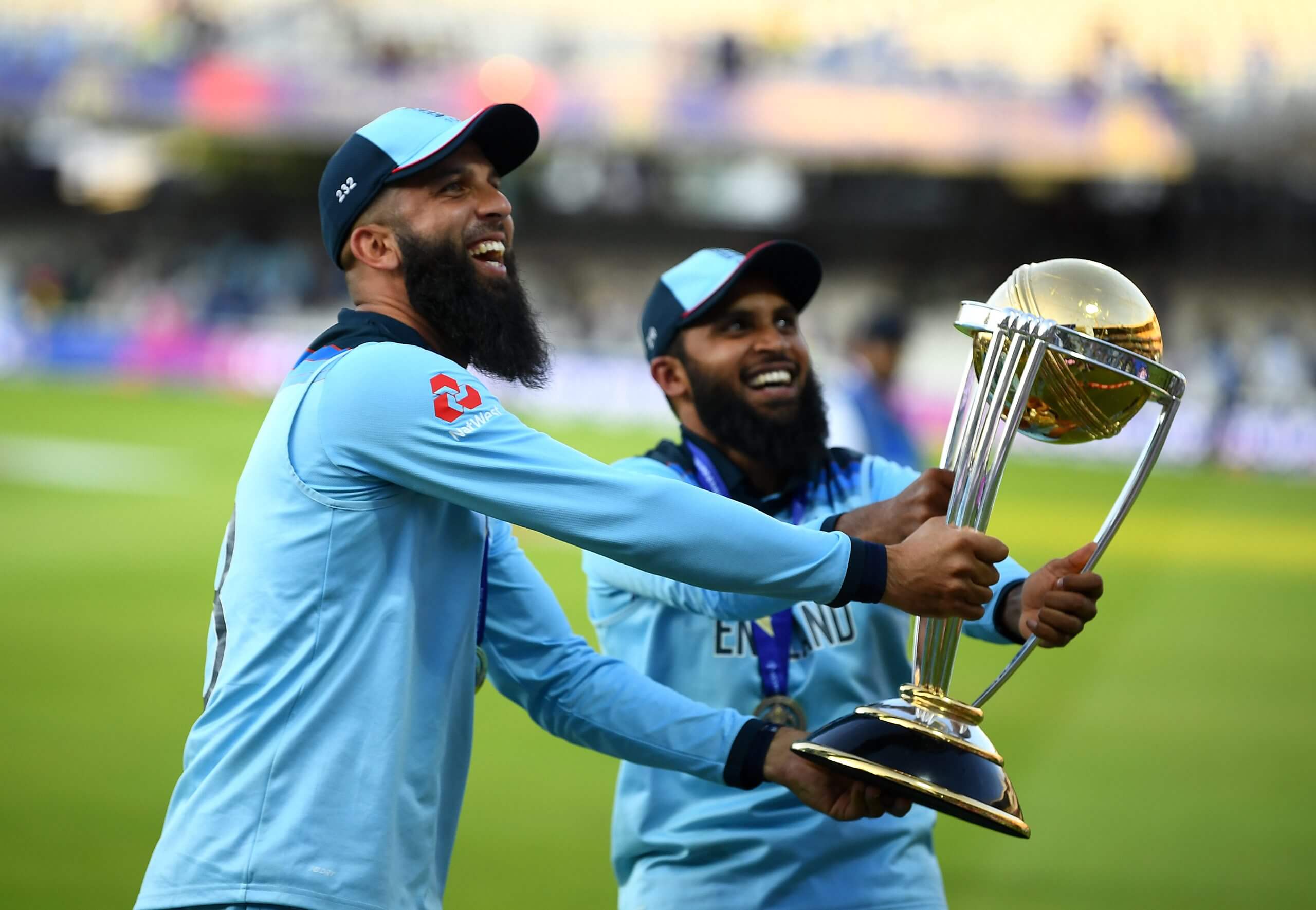 Moeen Ali and Adil Rashid celebrate England's World Cup triumph in 2019