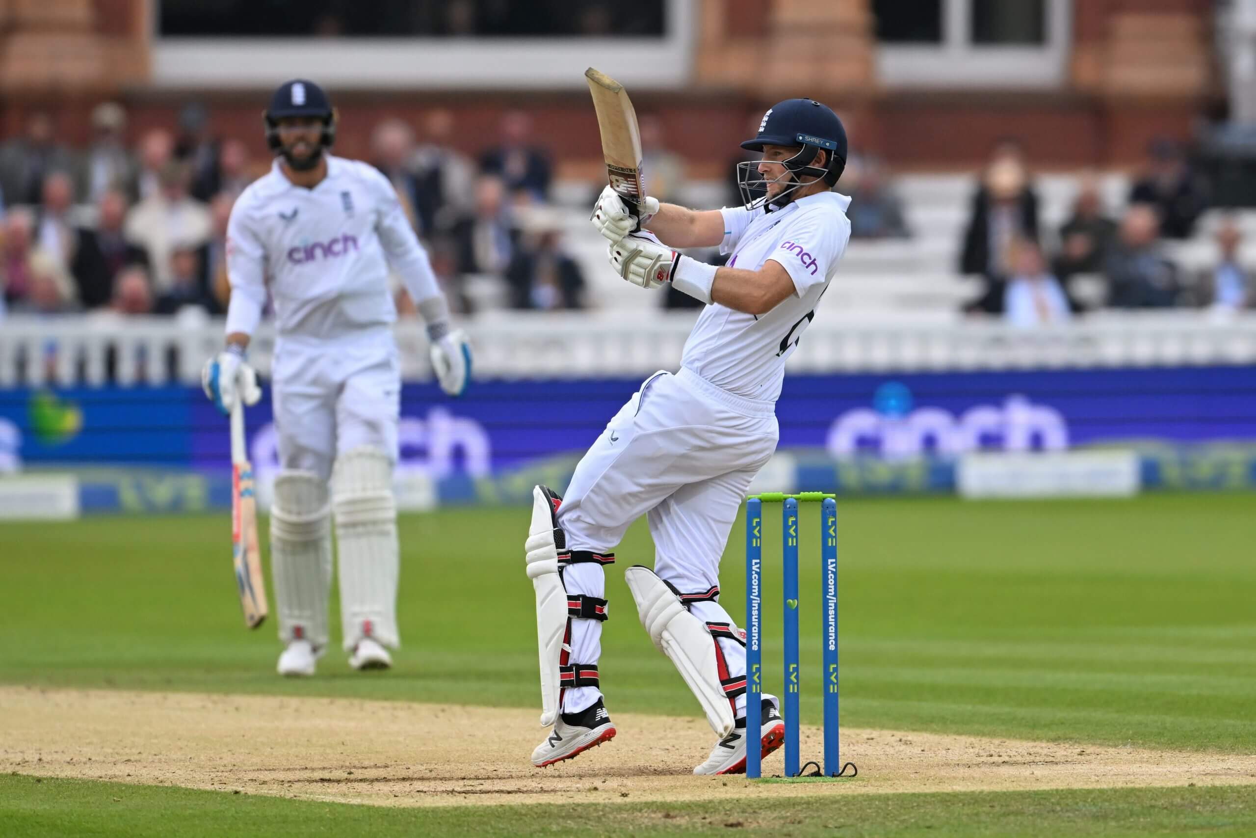 Joe Root hooks on his way to a match-winning century at Lord's in 2022