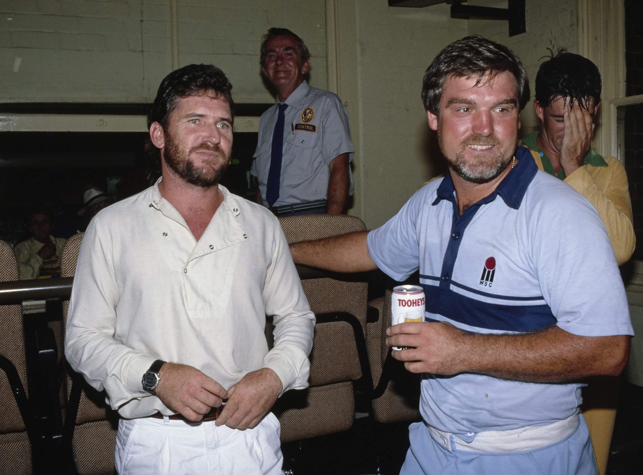 England captain Mike Gatting enjoys a post-match beer with his opposite number, Australia's Allan Border, after the second World Tri Series final at the SCG in 1987
