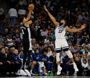 SAN ANTONIO, TX - NOVEMBER 2: Victor Wembanyama #1 of the San Antonio Spurs shots over Rudy Gobert #27 of the Minnesota Timberwolves share a light moment in the second half at Frost Bank Center on November 2, 2024 in San Antonio, Texas. NOTE TO USER: User expressly acknowledges and agrees that, by downloading and or using this photograph, User is consenting to terms and conditions of the Getty Images License Agreement. (Photo by Ronald Cortes/Getty Images)
